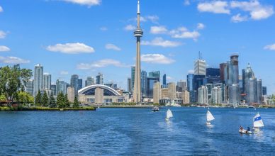 Toronto's skyline with CN Tower over lake